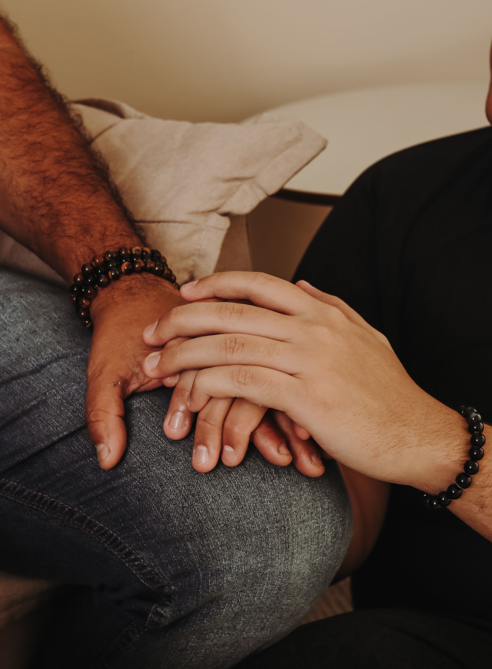Two hands gently holding, symbolizing support and reassurance